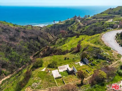 a view of ocean and mountain