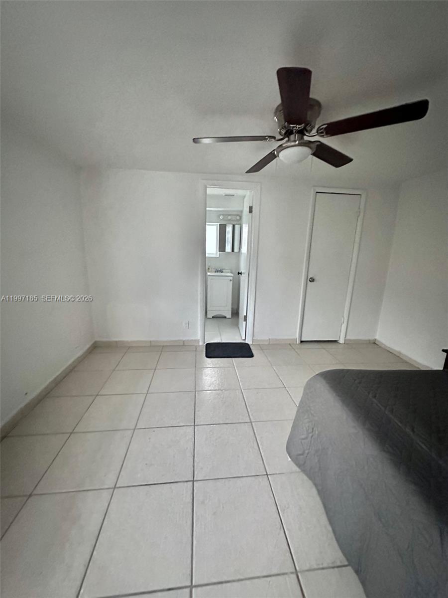 1375 Northwest 84th Terrace, Unit A Miami, FL 33147 - Photo 9 of 11 a view of an empty room with a window