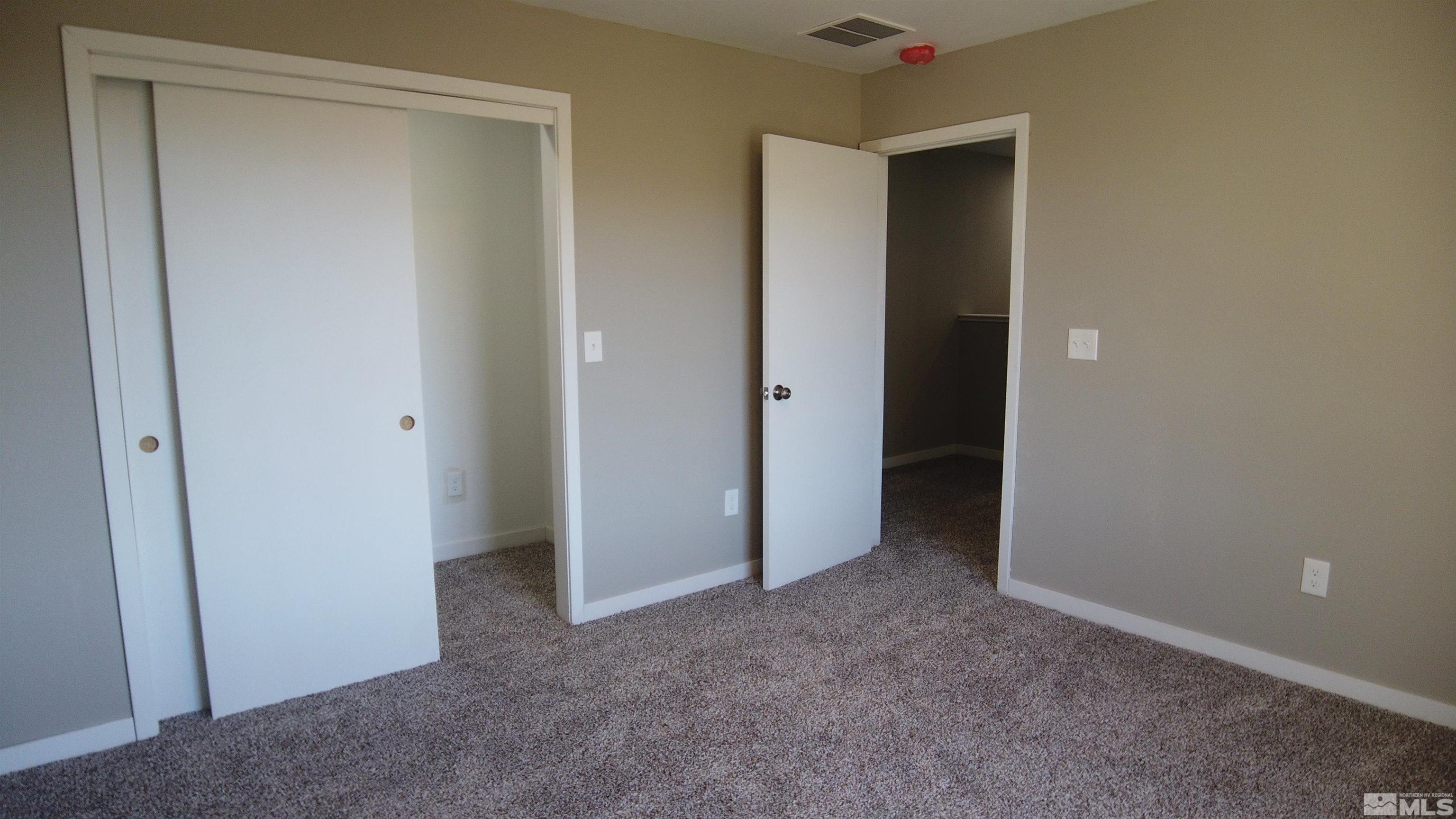 2650 Apollo Way Reno, NV 89503 - Photo 28 of 36 a view of an empty room with closet and wooden floor