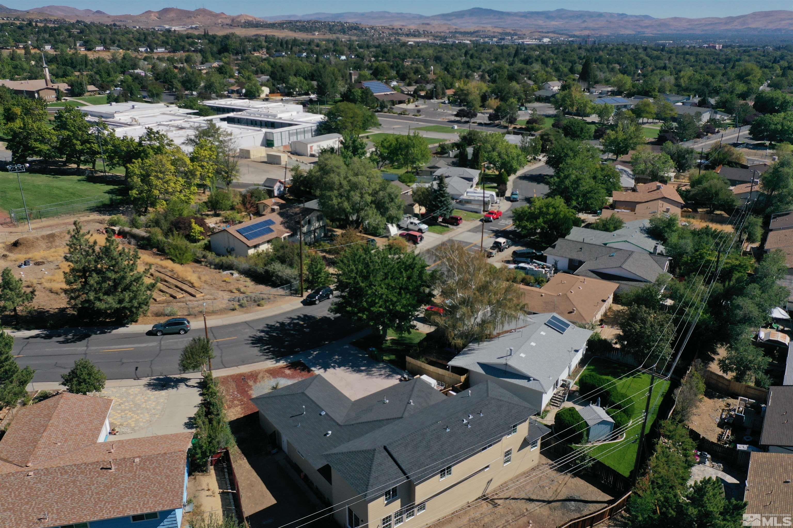 2650 Apollo Way Reno, NV 89503 - Photo 7 of 36 an aerial view of a city with lots of residential buildings