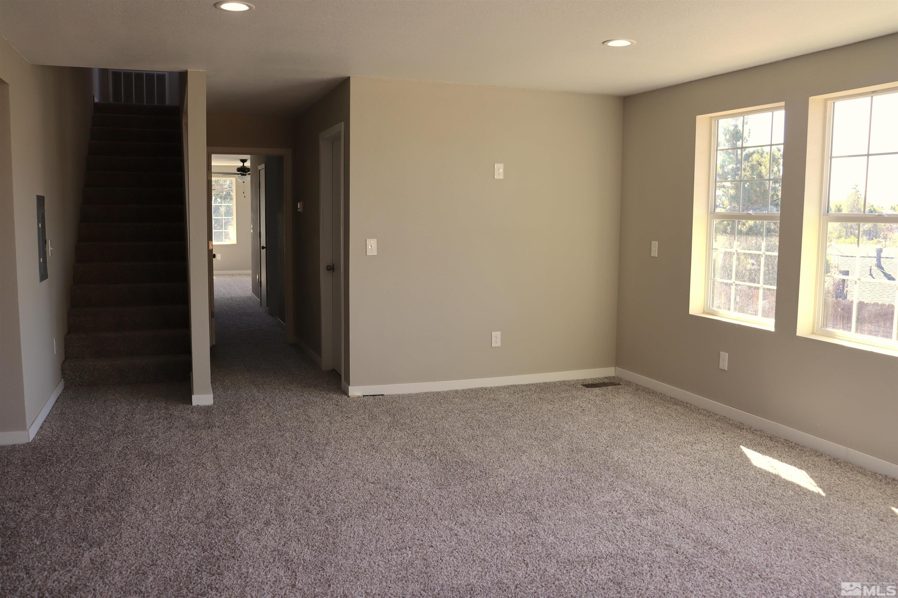 2650 Apollo Way Reno, NV 89503 - Photo 9 of 36 an empty room with windows and closet