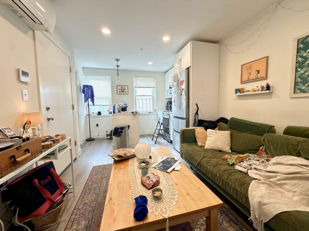46 Melrose Street, Unit 3 Boston, MA 02116 - Photo 14 of 20 a living room with furniture and a wooden floor