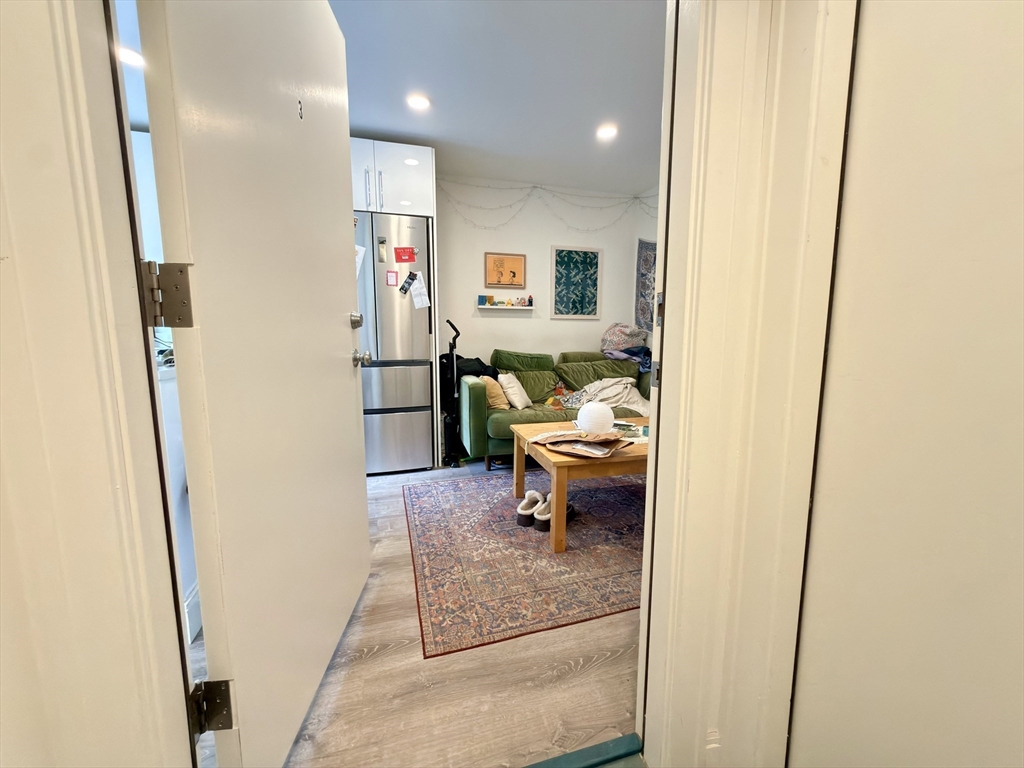 46 Melrose Street, Unit 3 Boston, MA 02116 - Photo 3 of 20 a view of living room with furniture and wooden floor