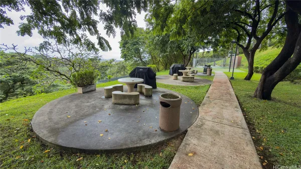 a view of swimming pool with outdoor seating