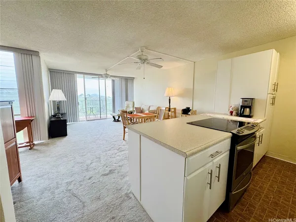 a kitchen with stainless steel appliances a sink a counter top space and cabinets