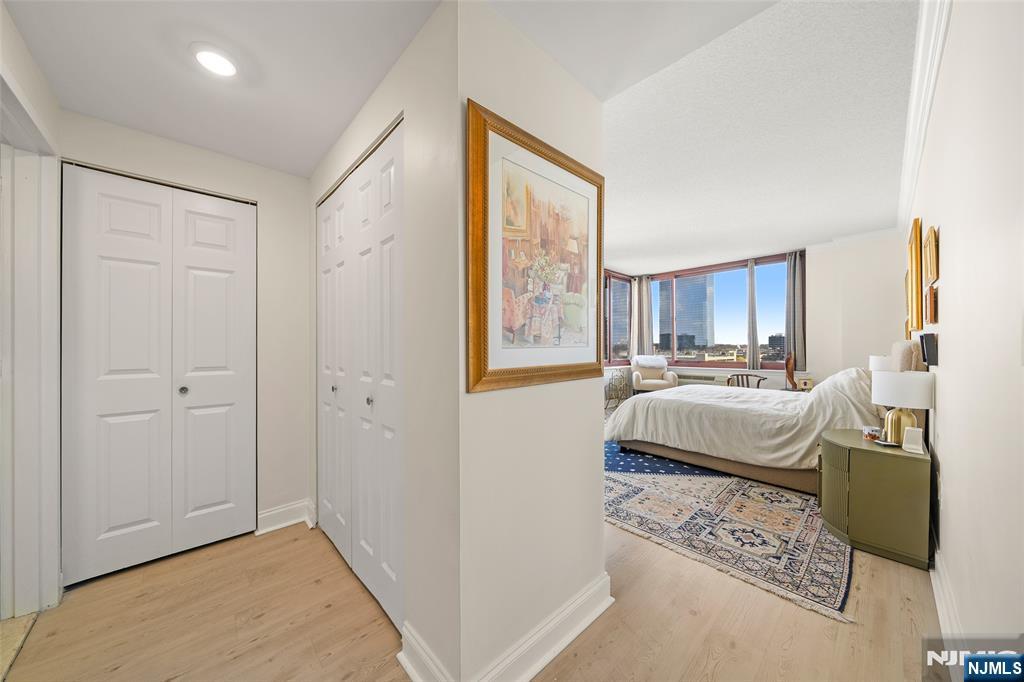 100 Old Palisade Road, Unit 2311 Fort Lee, NJ 07024 - Photo 13 of 25 a living room with a bed furniture and a window