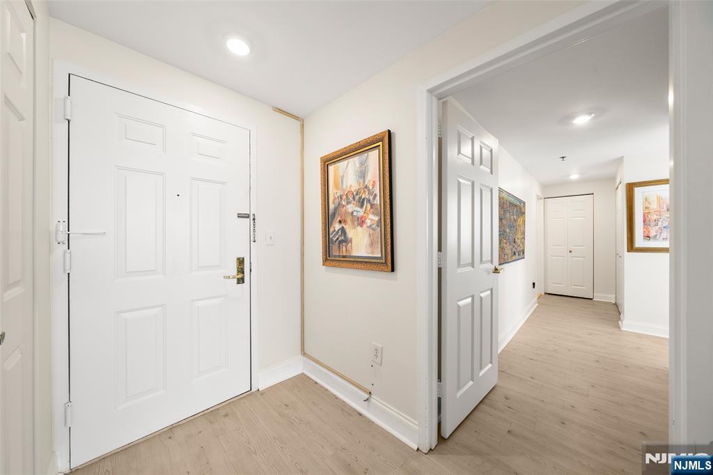 100 Old Palisade Road, Unit 2311 Fort Lee, NJ 07024 - Photo 3 of 25 a view of a hallway with wooden floor