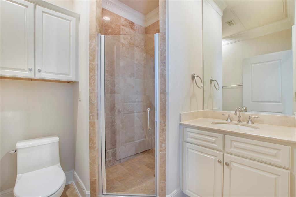 6425 Bandera Avenue, Unit 2D Dallas, TX 75225 - Photo 6 of 8 Bathroom featuring toilet, ornamental molding, walk in shower, and vanity