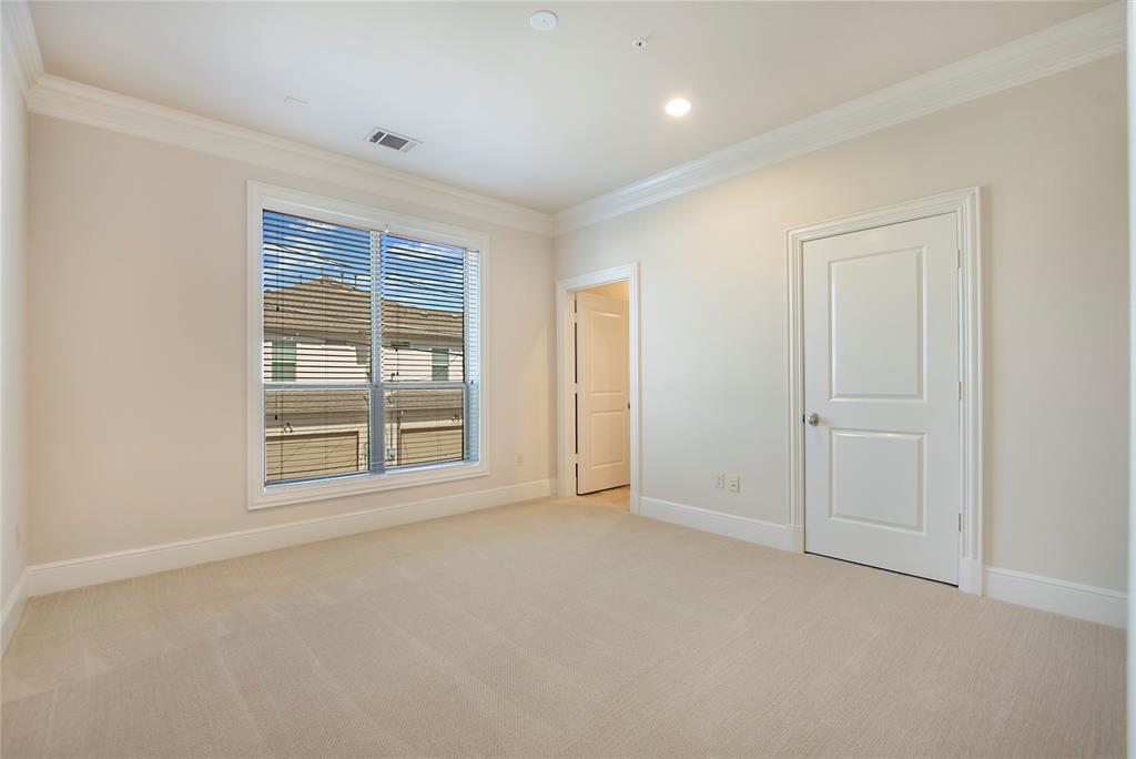 6425 Bandera Avenue, Unit 2D Dallas, TX 75225 - Photo 7 of 8 Carpeted spare room featuring crown molding