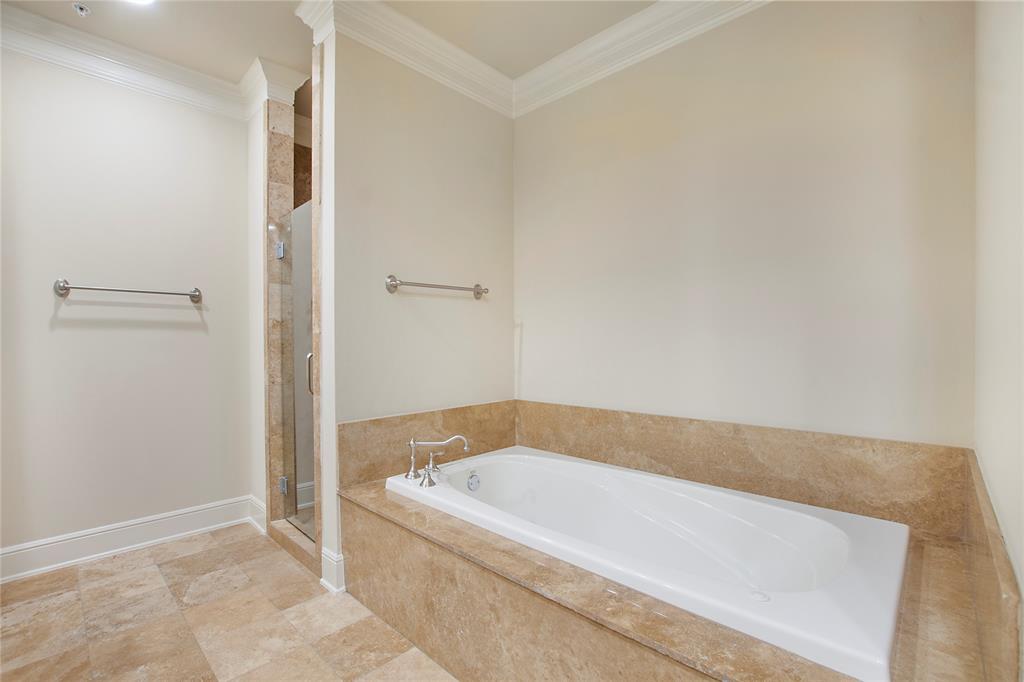 6425 Bandera Avenue, Unit 2D Dallas, TX 75225 - Photo 8 of 8 Bathroom featuring ornamental molding and independent shower and bath