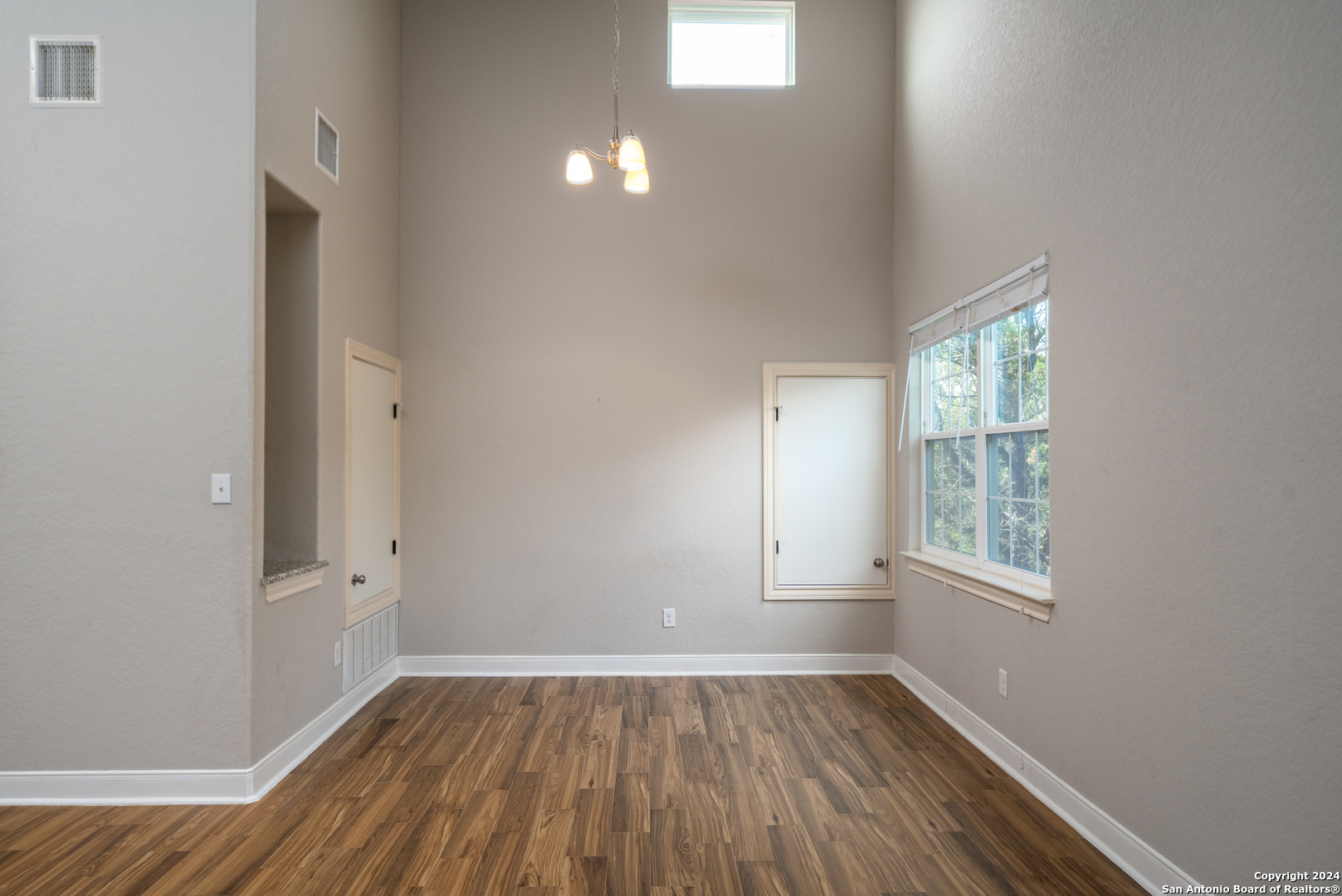 3067 View Ridge Drive, Unit 7 Spring Branch, TX 78070 - Photo 13 of 21 an empty room with wooden floor and windows