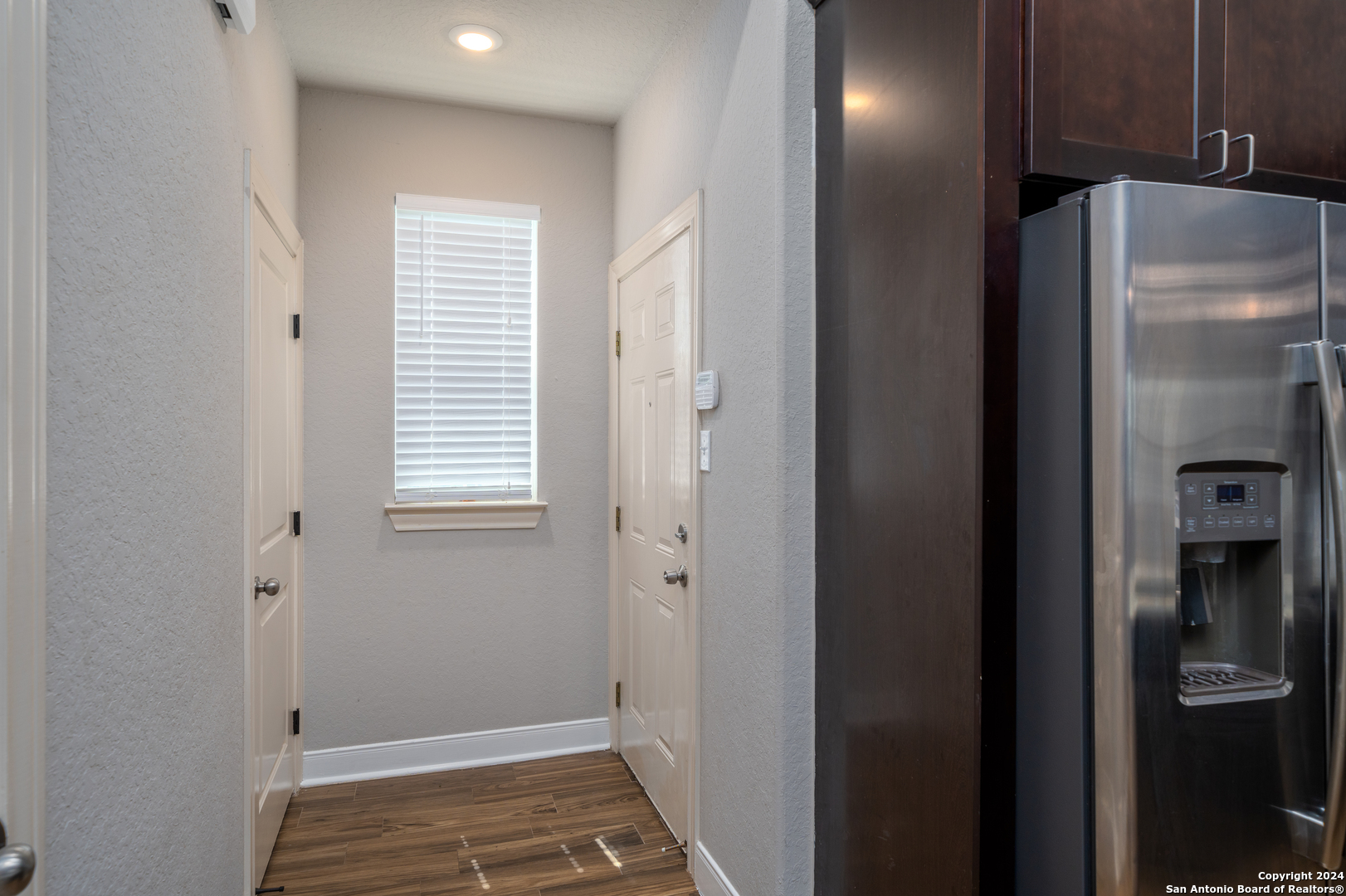 3067 View Ridge Drive, Unit 7 Spring Branch, TX 78070 - Photo 10 of 21 a view of an empty room with wooden floor and a window