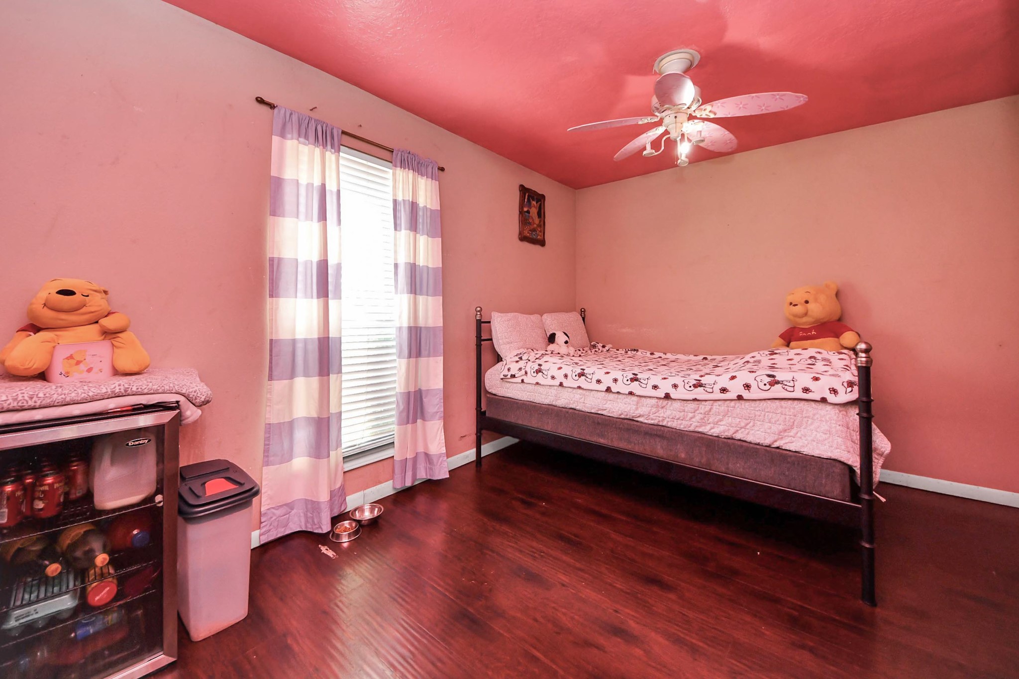 6719 Rubilee Avenue Humble, TX 77396 - Photo 12 of 23 a bedroom with a bed and wooden floor
