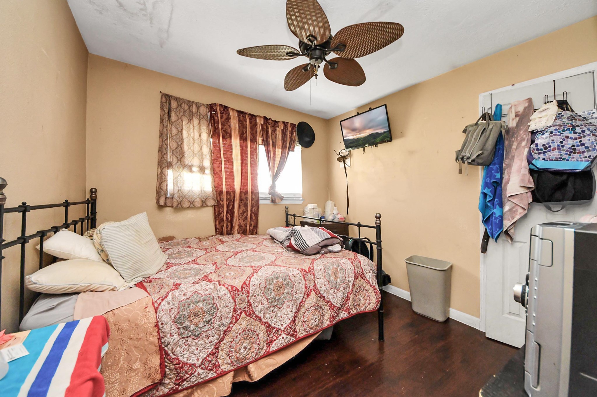 6719 Rubilee Avenue Humble, TX 77396 - Photo 14 of 23 a bedroom with a bed and a chandelier