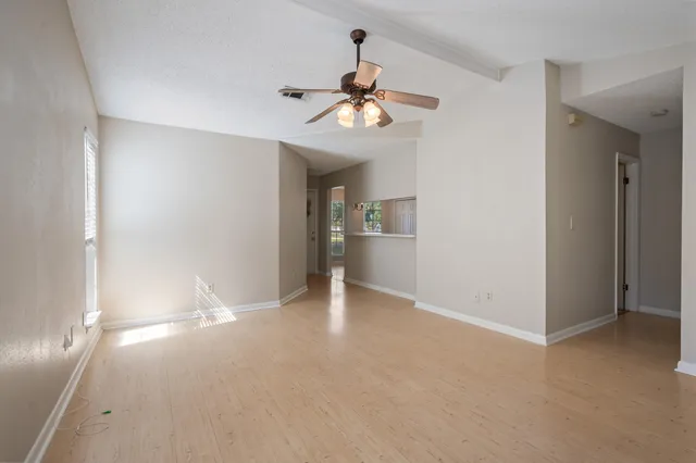 a view of an empty room with a window