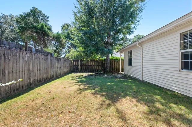 a backyard of a house with green landscape