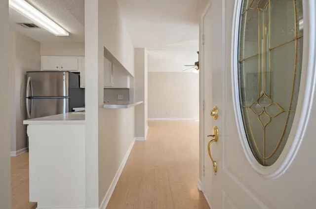 a bathroom with a walk in closet and mirror