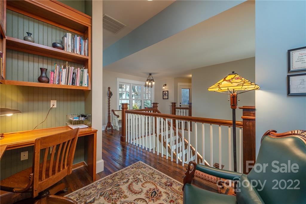 1116 Glades Road Clyde, NC 28721 - Photo 19 of 48 a bedroom with furniture and a book shelf