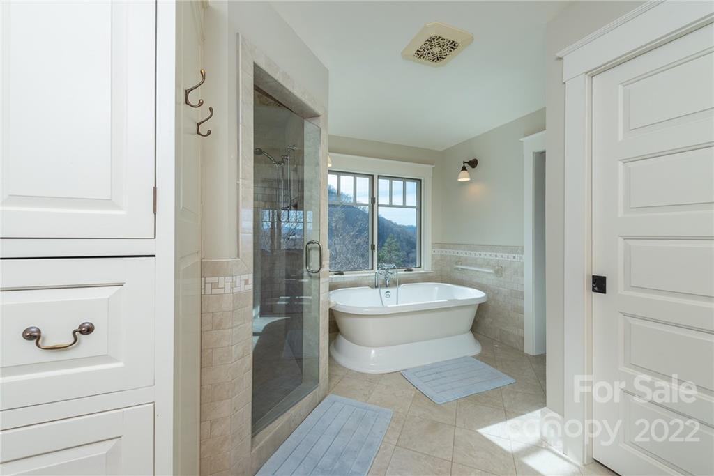 1116 Glades Road Clyde, NC 28721 - Photo 23 of 48 a bathroom with a toilet a sink and shower