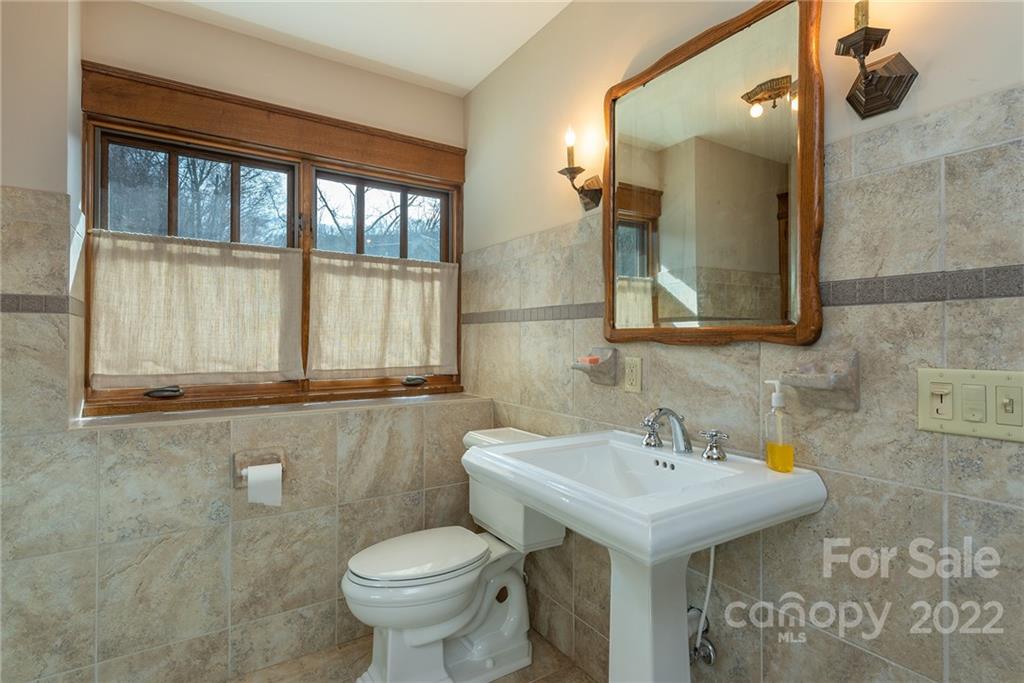 1116 Glades Road Clyde, NC 28721 - Photo 34 of 48 a bathroom with a sink and a toilet