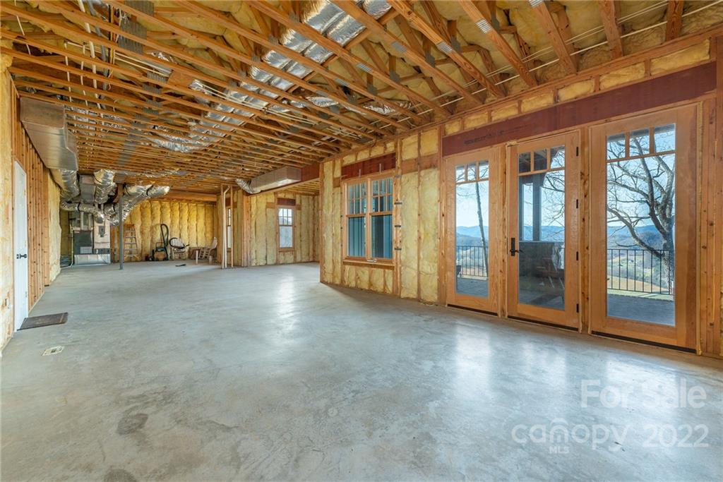 1116 Glades Road Clyde, NC 28721 - Photo 40 of 48 a view of an empty room with a balcony