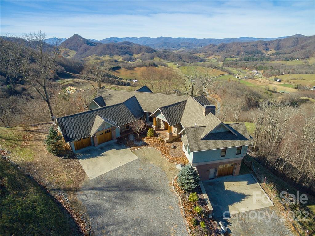 1116 Glades Road Clyde, NC 28721 - Photo 4 of 48 an aerial view of a house with mountain view