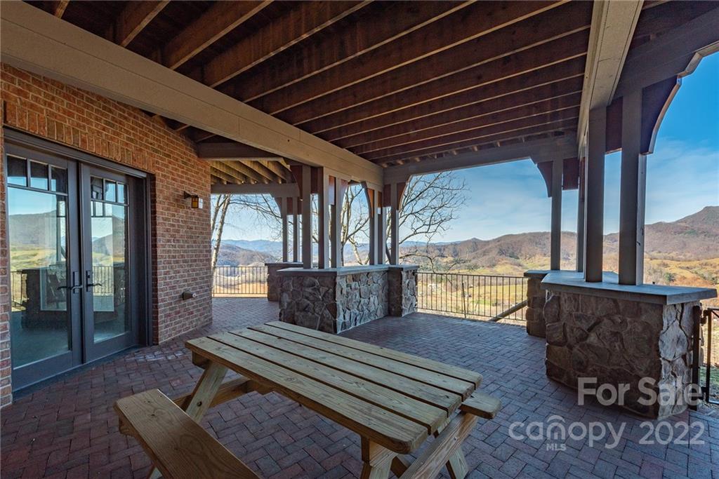1116 Glades Road Clyde, NC 28721 - Photo 42 of 48 a outdoor living space with furniture and a fireplace