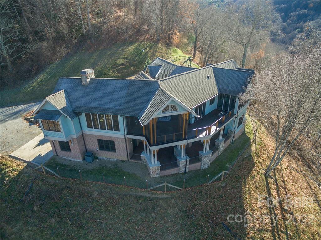 1116 Glades Road Clyde, NC 28721 - Photo 6 of 48 an aerial view of a house with a yard