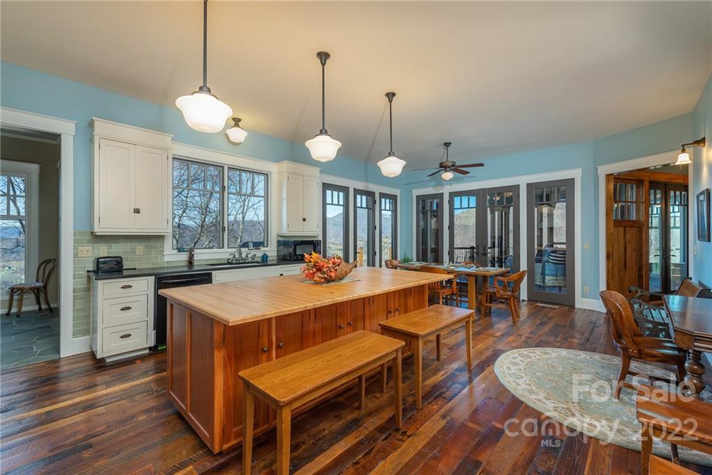 1116 Glades Road Clyde, NC 28721 - Photo 8 of 48 a large kitchen with a table and chairs