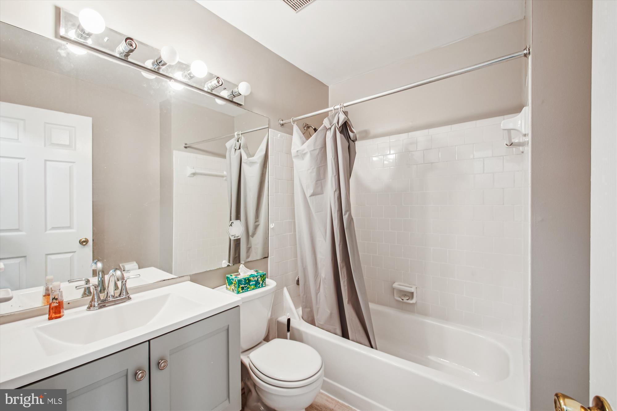 9469 Clocktower Lane Columbia, MD 21046 - Photo 18 of 28 a bathroom with a sink toilet and shower