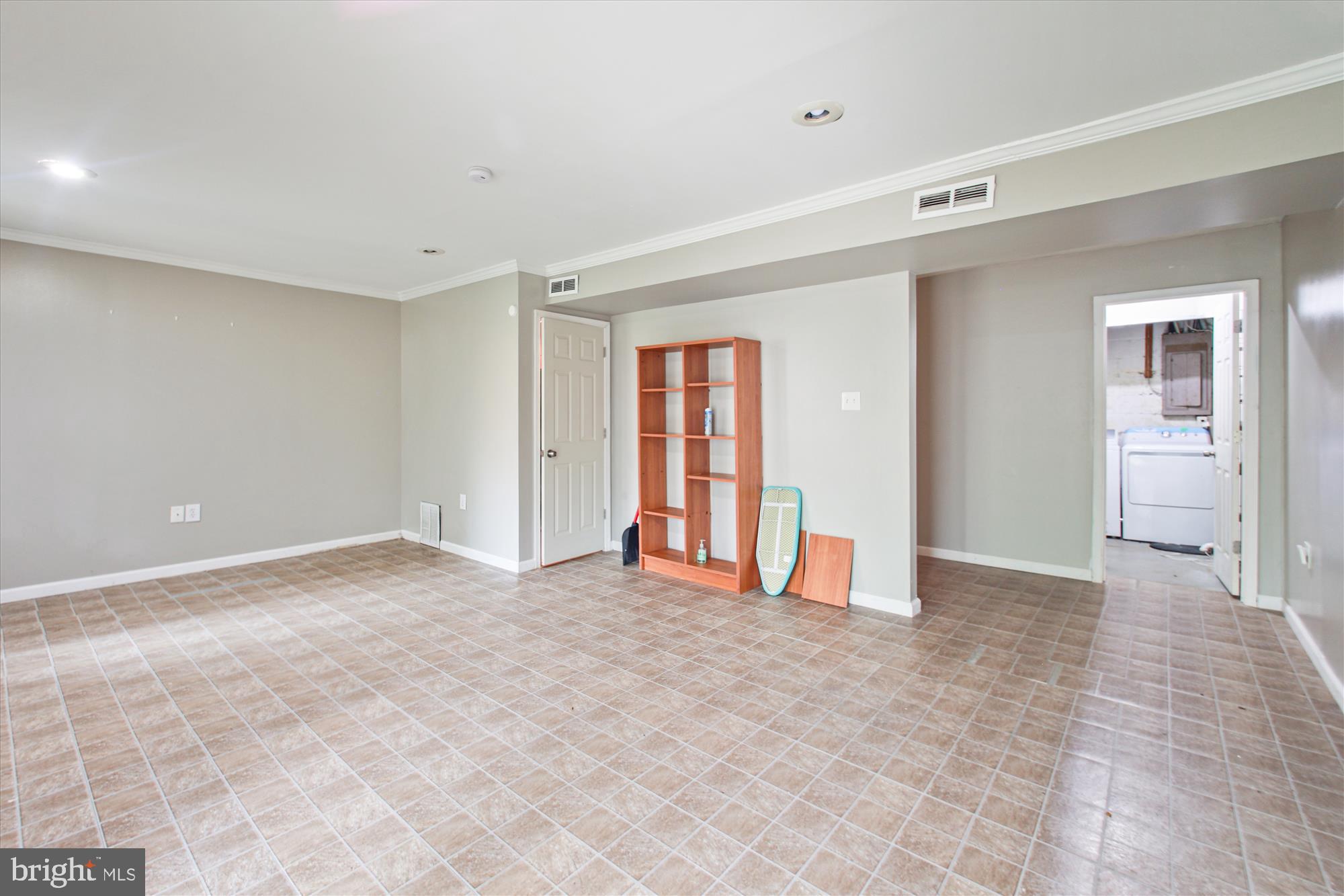 9469 Clocktower Lane Columbia, MD 21046 - Photo 24 of 28 a view of an empty room with window and wooden floor