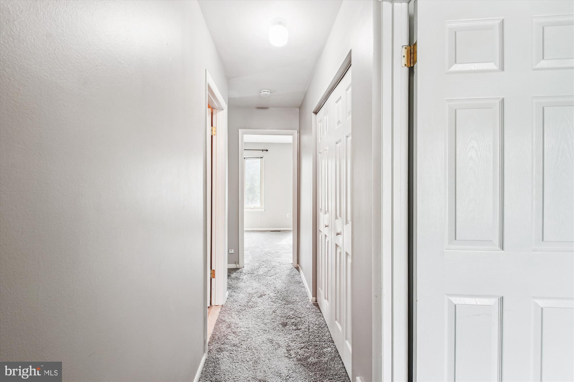 9469 Clocktower Lane Columbia, MD 21046 - Photo 25 of 28 a view of a hallway with white walls