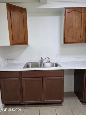 a bathroom with a toilet a sink and shower