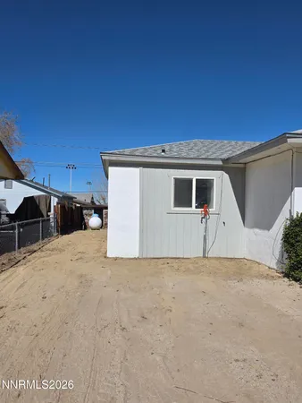 a view of a house with a snow in the background