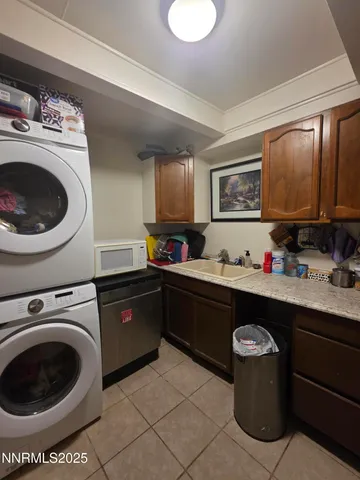 a kitchen with a sink cabinets and appliances