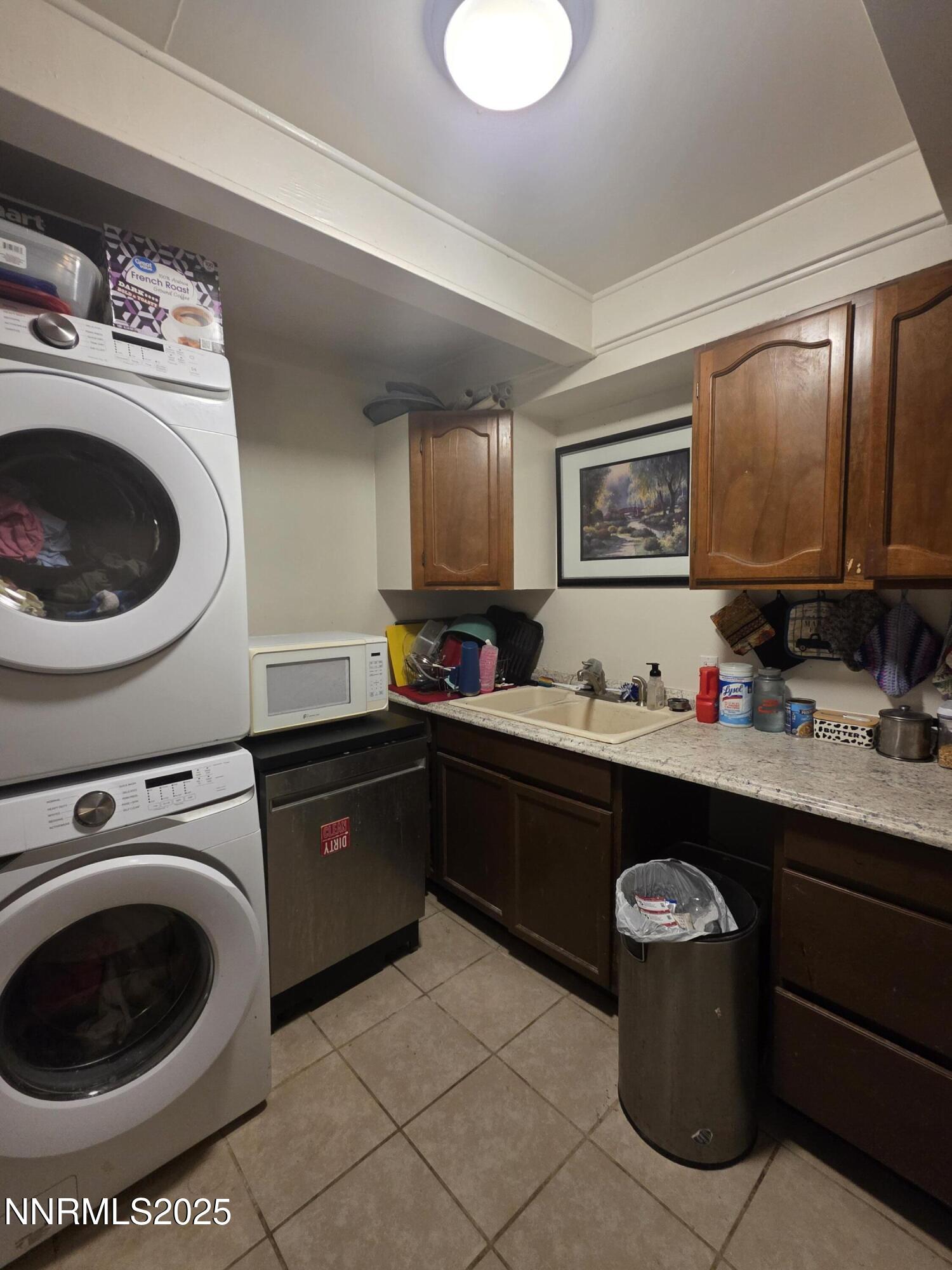 107 English Street Hawthorne, NV 89415 - Photo 8 of 21 a kitchen with a sink cabinets and appliances