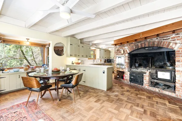 a kitchen with stainless steel appliances granite countertop a stove and a refrigerator