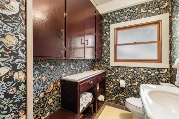 a bedroom with a bed and a table in it
