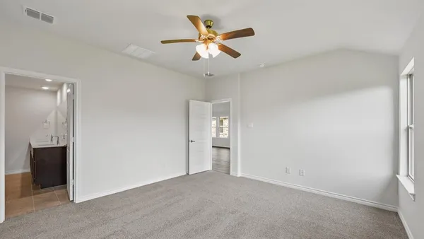 a view of a kitchen with a sink and a refrigerator