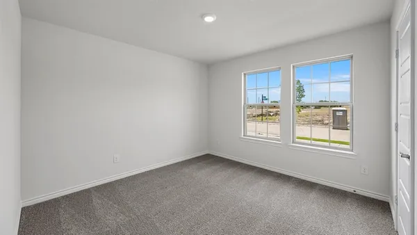 a bathroom with a shower and a glass door