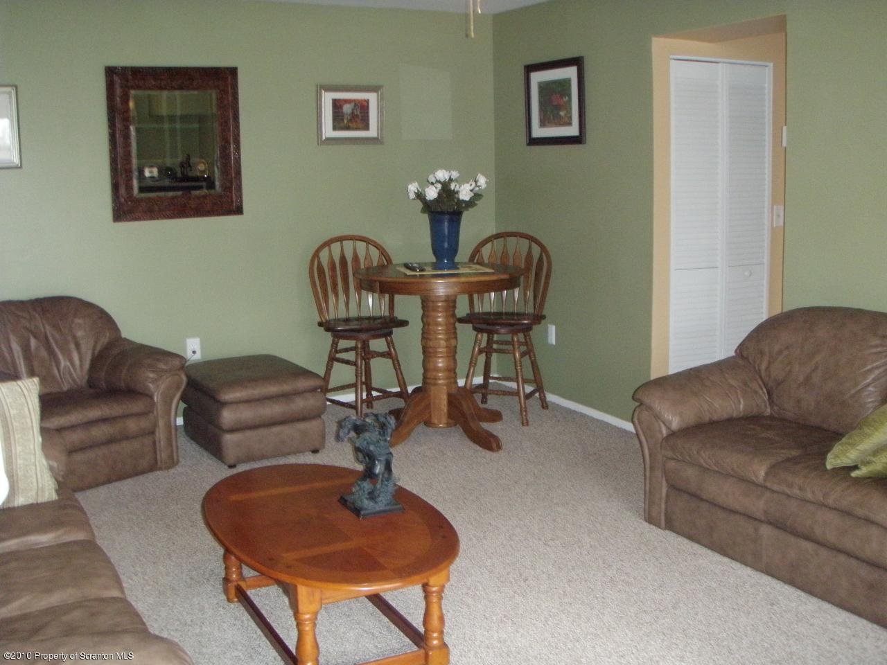 1206 Summit Pointe Scranton, PA 18508 - Photo 6 of 14 a living room with furniture and a chandelier
