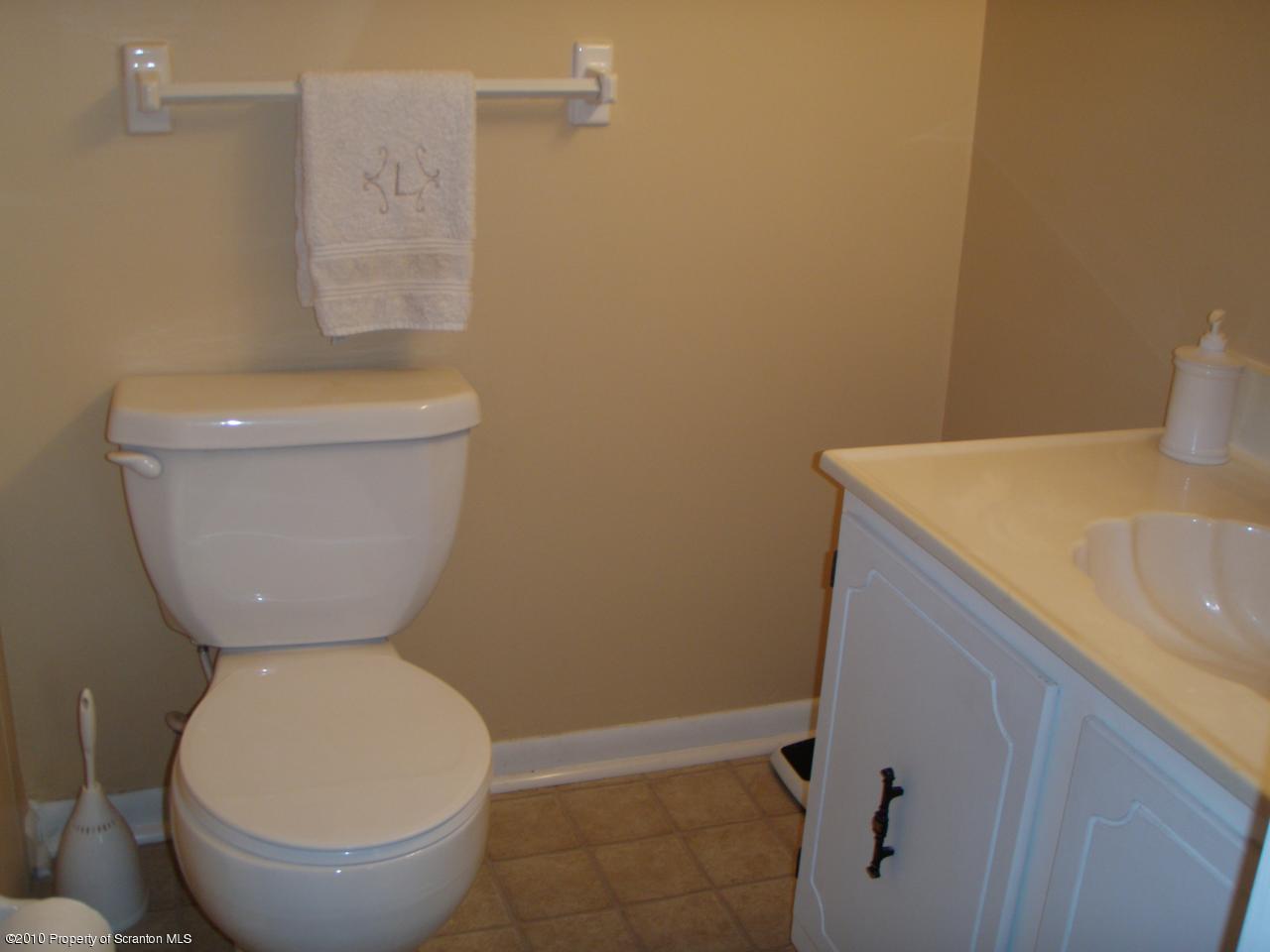 1206 Summit Pointe Scranton, PA 18508 - Photo 10 of 14 a bathroom with a toilet and a sink