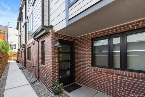 a view of a brick building with an empty space