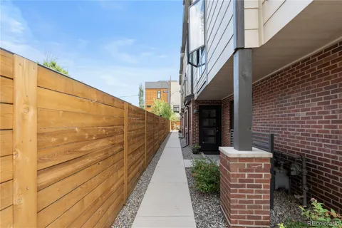 a view of a pathway with a building in the background