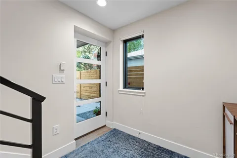 a view of an empty room with windows