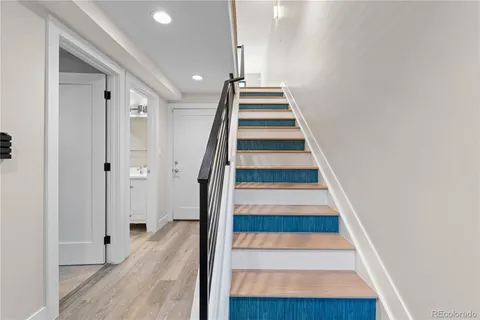 a view of entryway and hall with wooden floor