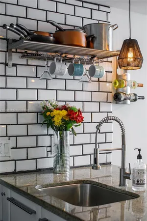 a kitchen with a sink and a stove