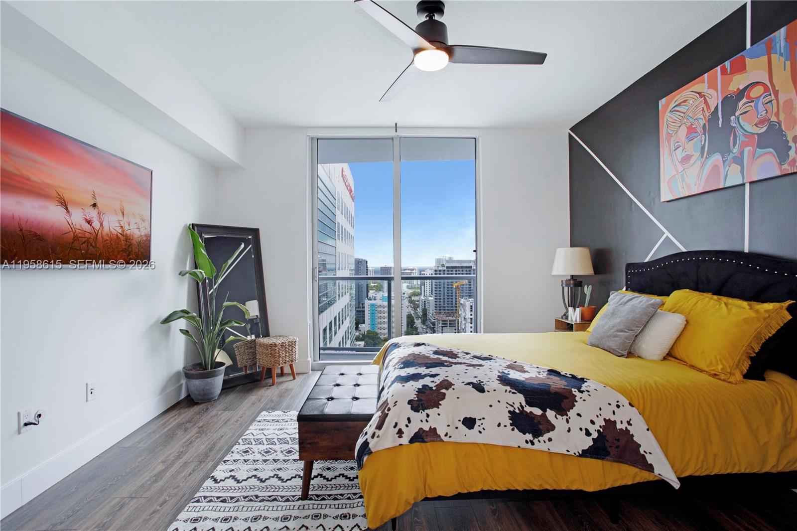 185 Southwest 7th Street, Unit 2514 Miami, FL 33130 - Photo 2 of 33 a bedroom with a bed a dresser and potted plants