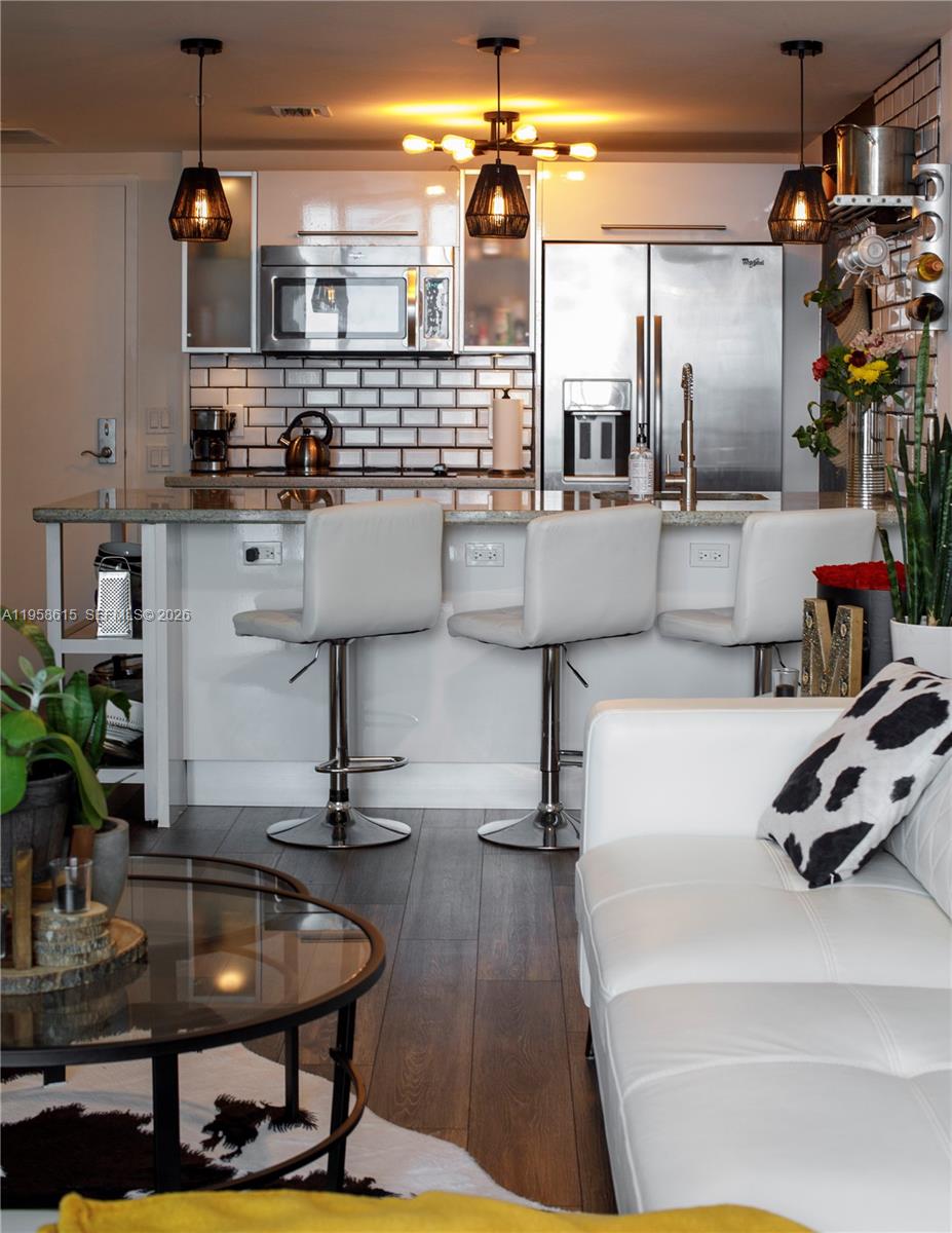 185 Southwest 7th Street, Unit 2514 Miami, FL 33130 - Photo 29 of 33 a kitchen with a sink and a refrigerator