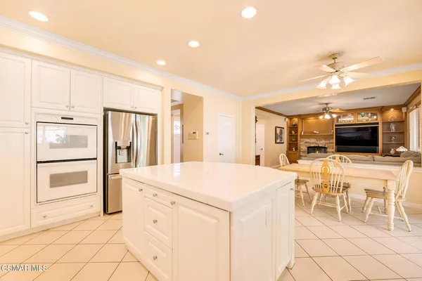 a spacious bathroom with a double vanity sink toilet and shower